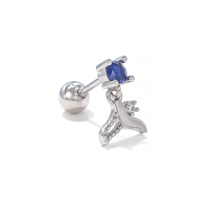 Detail shot of a blue zircon screw back stud earring with a silver mermaid tail drop charm