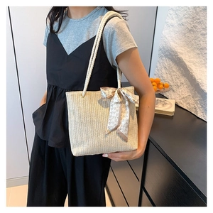 Summer straw tote bag with fine V-shaped texture, silk scarf detail and rope handles