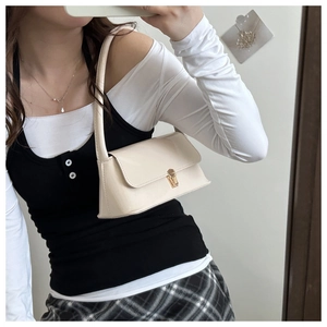 Creamy white patent leather baguette shoulder bag with elegant gold twist-lock fastener