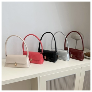 Minimalist patent leather baguette bags in five colors with sleek metal buckles