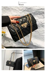 Detail showing black quilted leather crossbody bag with elegant gold chain strap