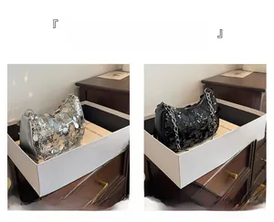 Detail view of silver and black sequin handbags with metallic chain straps and zipper