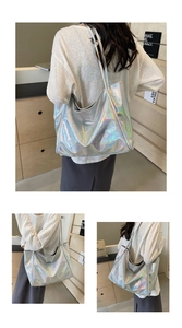 Detail showing the iridescent holographic silver tote bag with metallic leather texture