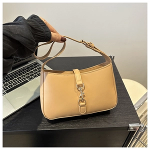 Chic apricot half-moon shoulder bag with vintage silver buckle and matte leather finish