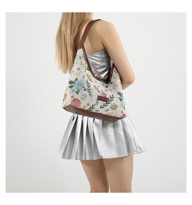 Floral embroidered canvas hobo bag with brown faux leather straps for summer fashion
