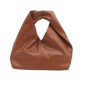 Caramel brown soft leather bucket bag with unique pleated design and integrated handle