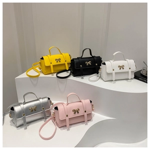 Stylish crossbody handbags for women in multiple colors with golden bow decoration