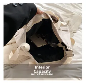 Internal view of the beige canvas tote bag showing spacious capacity and black lining
