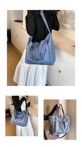 Detail of waterproof nylon tote bag showing multiple pockets and adjustable shoulder strap