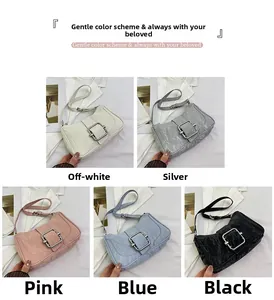 Close-up of pleated shoulder bags in five colors with iconic square metal buckles