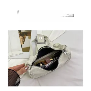 Top view of cream white faux leather shoulder bag interior showing large capacity storage