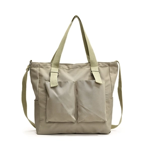 Khaki nylon tote bag with dual front pockets and adjustable shoulder strap for women