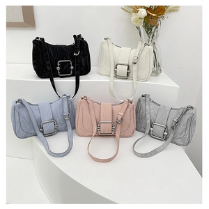 Minimalist faux leather hobo bags with silver buckles in black, white, blue, pink, and grey