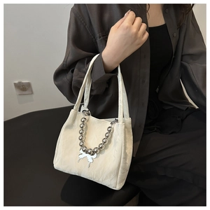 Elegant white bucket bag with large silver bead chain and butterfly pendant for women