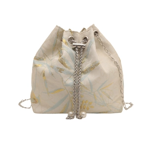 New Chinese style bucket bag with gold bamboo leaf print, pearl tassels and chain strap