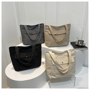 Grands sacs fourre-tout en toile de quatre couleurs avec poches boutonnées devant