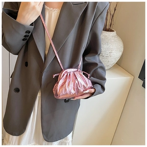 Mini metallic pink cloud bag with drawstring pleats and slender crossbody strap