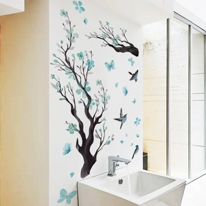 Detail of floral wall sticker with birds and branches in a modern bathroom setting