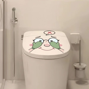 Detail of cartoon old lady toilet seat sticker in a modern bathroom setting