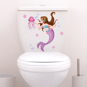 Mermaid and jellyfish ocean themed wall decal on white toilet tank in bathroom
