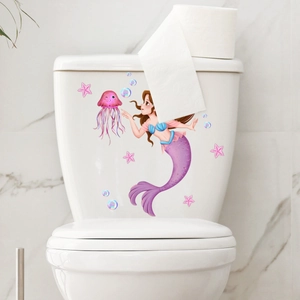 Detail of mermaid and jellyfish toilet stickers on a white ceramic tank surface