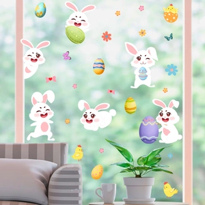 Easter wall decals featuring cartoon bunnies and colorful eggs on a window background