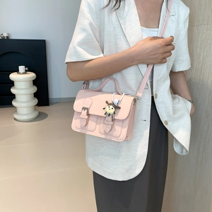 Pink minimalist crossbody Cambridge bag with a cute doll pendant for women and girls