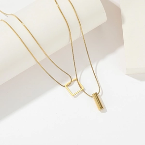 Minimalist gold-plated double-layer snake chain necklace with geometric square and cylinder pendants