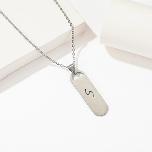 Minimalist silver stainless steel necklace with cutout letter S rectangular pendant