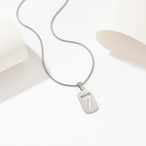 Minimalist silver titanium steel necklace with a hollow number seven pendant on a snake chain