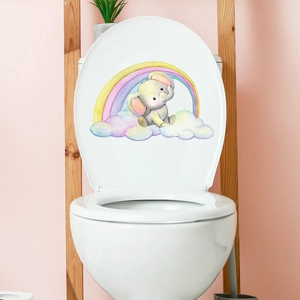 Cartoon elephant and rainbow toilet lid sticker on white ceramic in a cozy bathroom