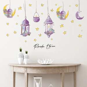 Detail of Ramadan wall stickers with purple lanterns and moon on a white living room wall