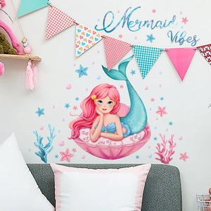 Detail of mermaid princess wall stickers with pink shells and bubbles in a kid's room