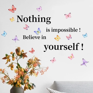 Detail of colorful watercolor butterfly wall stickers with motivational quotes on a wall