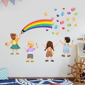 Detail view of colorful cartoon kids and rainbow wall decals in a creative nursery setup