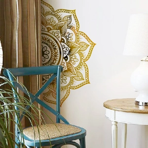 Detailed close-up of golden mandala wall sticker with intricate cutout patterns