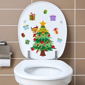 Detailed view of Merry Christmas toilet lid stickers with tree and gift motifs