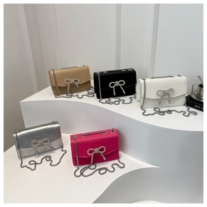 Chic chain crossbody bags in five colors with rhinestone bow on tiered platform