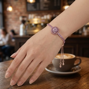 Adjustable rose gold bolo bracelet with rotating pink zircon flower and sliding closure