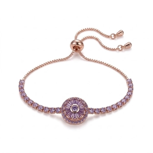 Adjustable rose gold floral bracelet featuring spinning purple zircon stones and slider clasp