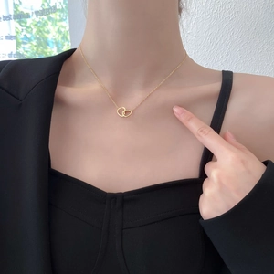 Titanium steel necklace for women featuring interlocking double hearts in gold finish