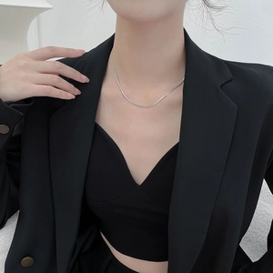 Minimalist silver-tone titanium snake bone chain necklace for women worn on collarbone