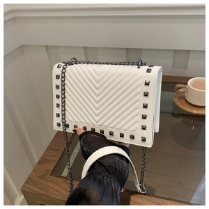 White V-quilted chain bag with metallic studs and silver shoulder strap for women