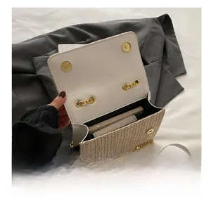 Internal view of straw chain bag showing capacity for a smartphone and daily essentials