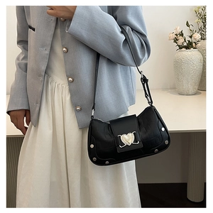 Fashionable black crocodile embossed underarm bag with silver heart buckle and metal studs