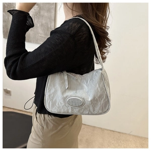 Minimalist silver pleated nylon shoulder bag for women with metallic texture and logo
