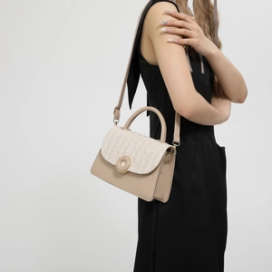 Chic beige leather and straw woven crossbody bag with round gold buckle for summer
