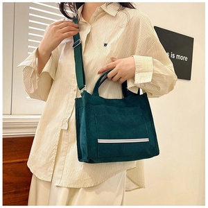 Dark green corduroy tote bag with adjustable shoulder strap for casual commute