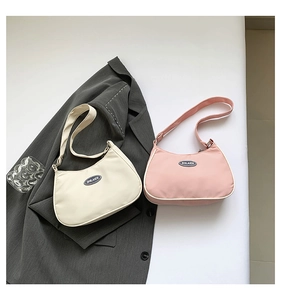 Detailed top view of hobo crescent bags in beige and pink nylon with hobo design