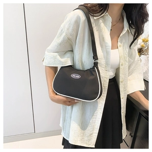 Lightweight black nylon shoulder bag with white trim and round logo on the front